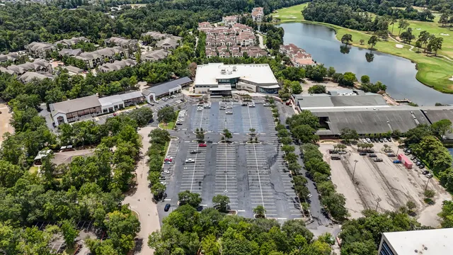 an aerial view of multiple houses with yard