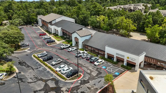 an aerial view of a house with outdoor space
