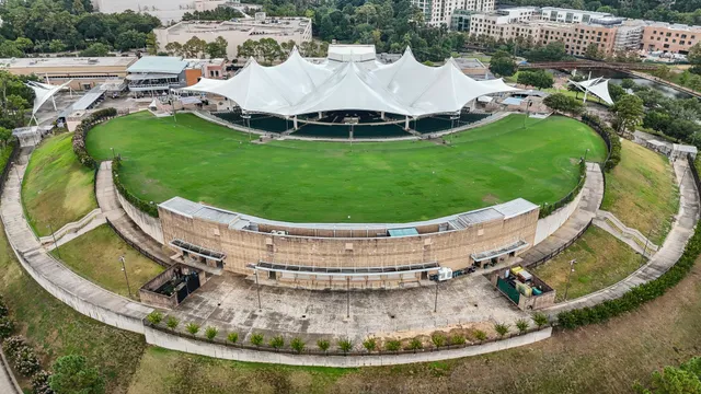 a view of a swimming pool with a yard