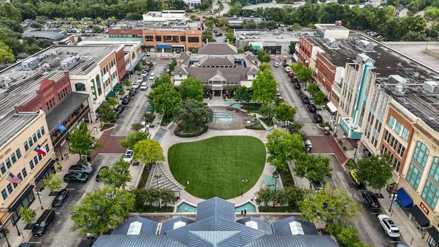 an aerial view of multiple house with yard