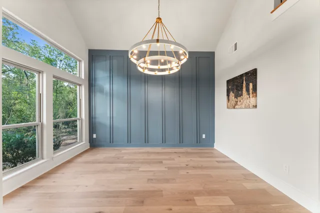 a view of an entryway with wooden floor