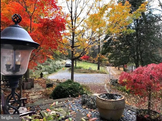 a room with a bed furniture and a large window