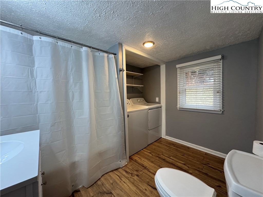 321 Skin Camp Creek Road Todd, NC 28684 - Photo 15 of 29 a bathroom with a sink toilet and shower