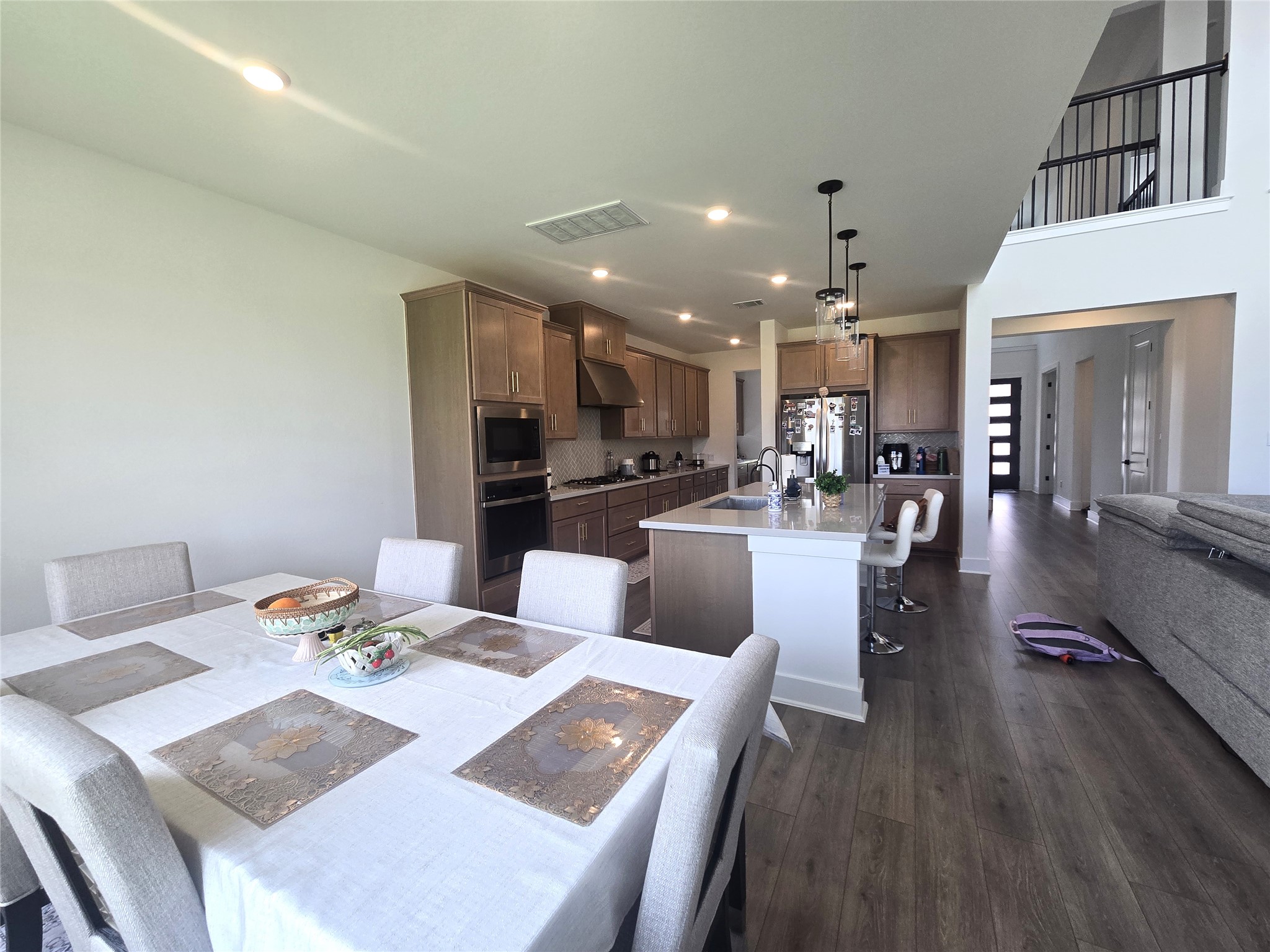 124 Ribera Drive Liberty Hill, TX 78642 - Photo 40 of 40 An open floorplan seamlessly connects the well-lit kitchen and dining areas.