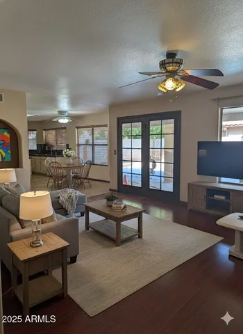 a living room with furniture and a large window