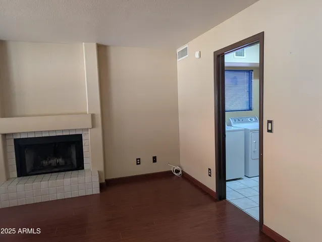 a kitchen with granite countertop white cabinets and a sink