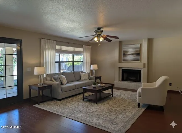 a living room with furniture and a fireplace