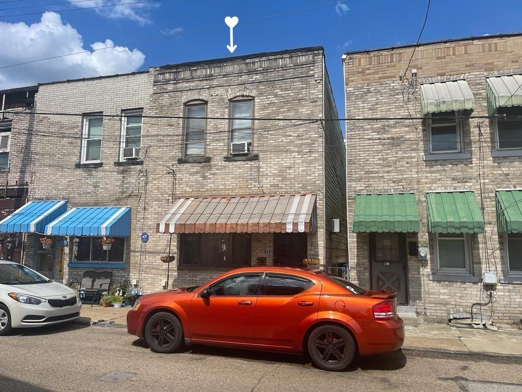 412 Shingiss Street McKees Rocks, PA 15136 - Photo 1 of 14 a car parked in front of a building