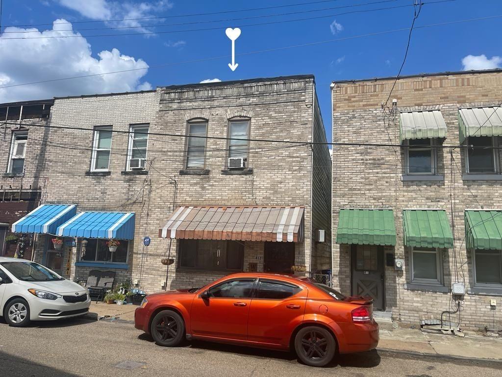 412 Shingiss Street McKees Rocks, PA 15136 - Photo 14 of 14 a car parked in front of a building