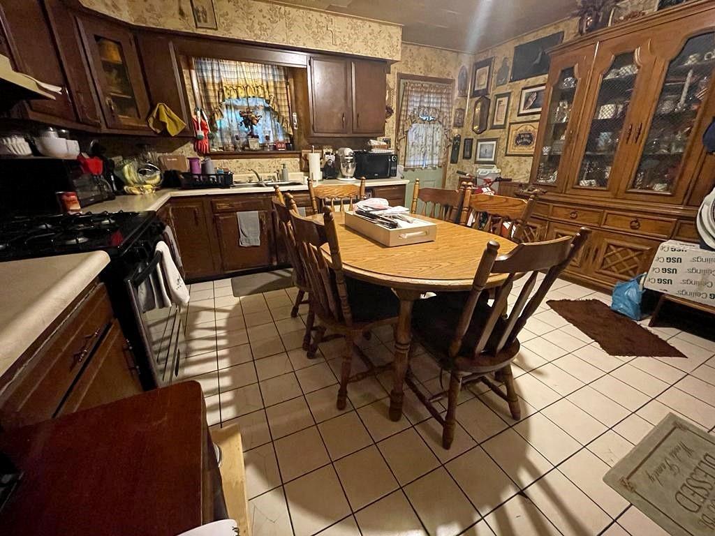 412 Shingiss Street McKees Rocks, PA 15136 - Photo 3 of 14 a view of a dining room with furniture
