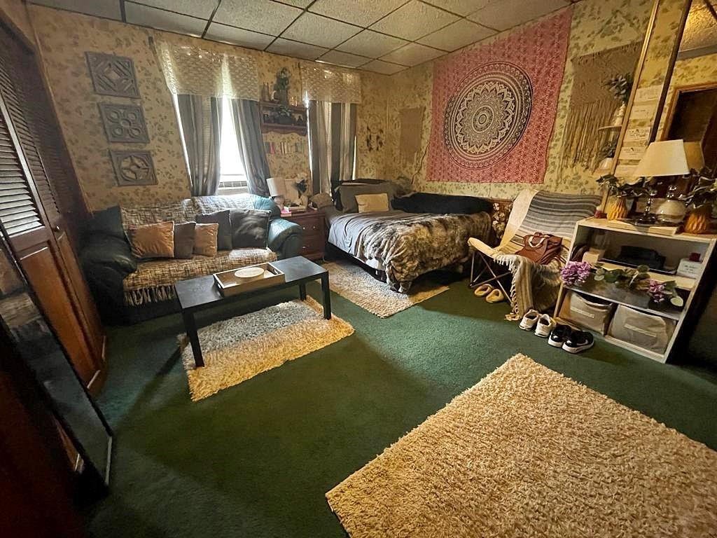 412 Shingiss Street McKees Rocks, PA 15136 - Photo 5 of 14 a living room with patio furniture and a wooden floor