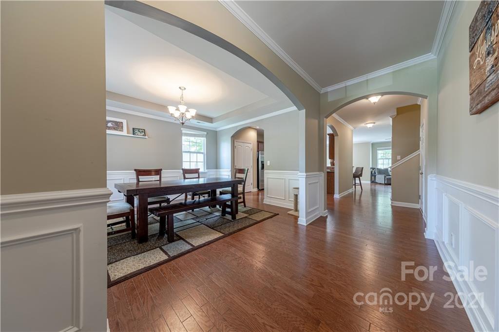 303 Lorraine Road Fort Mill, SC 29708 - Photo 2 of 30 a dining room with furniture and wooden floor