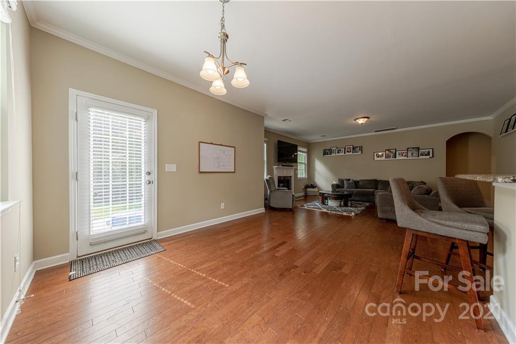303 Lorraine Road Fort Mill, SC 29708 - Photo 11 of 30 a living room with furniture and a chandelier