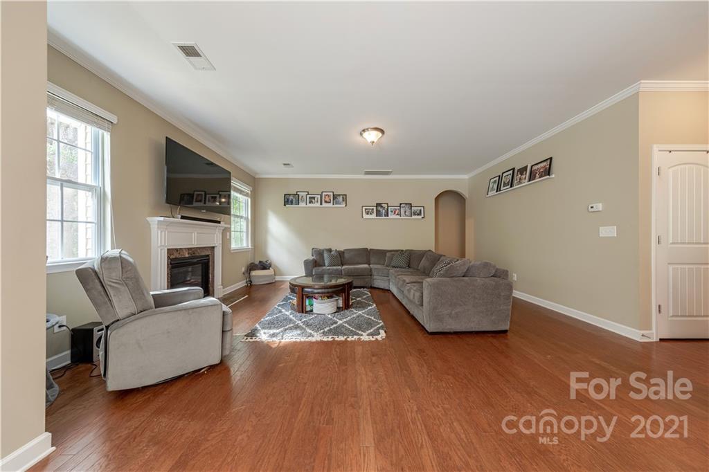 303 Lorraine Road Fort Mill, SC 29708 - Photo 12 of 30 a living room with furniture flat screen tv and a fireplace
