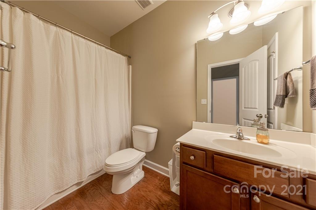 303 Lorraine Road Fort Mill, SC 29708 - Photo 15 of 30 a bathroom with a sink a toilet and a mirror