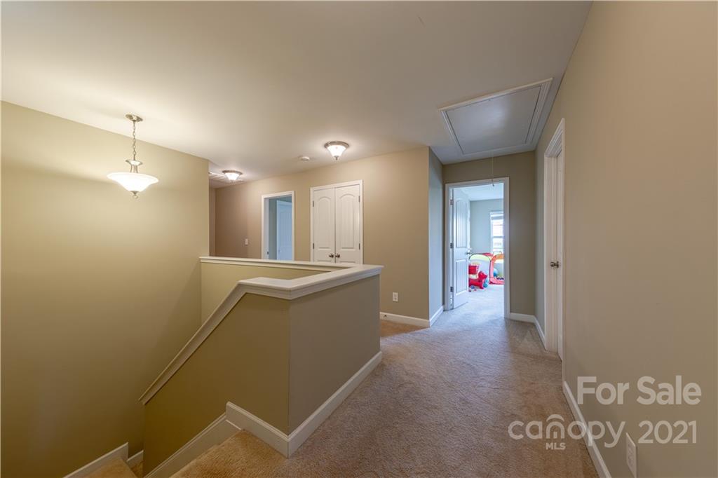 303 Lorraine Road Fort Mill, SC 29708 - Photo 16 of 30 a view of an empty room with wooden floor and a window