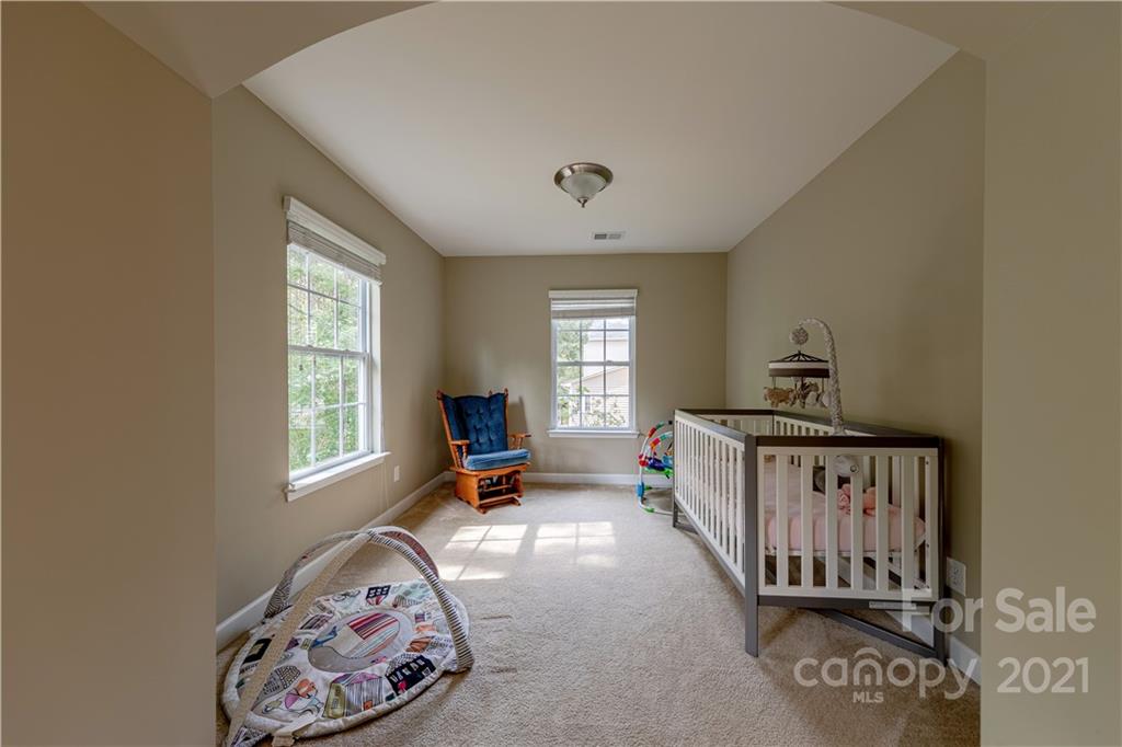 303 Lorraine Road Fort Mill, SC 29708 - Photo 19 of 30 a view of a bedroom with furniture and windows