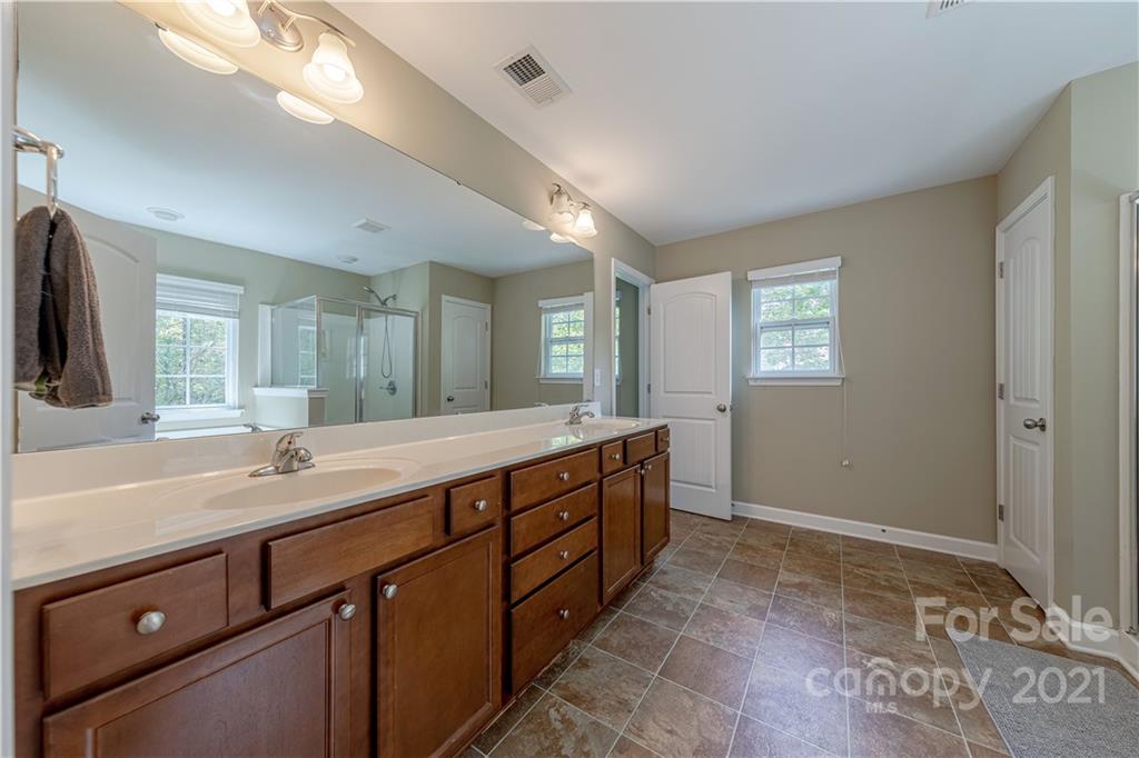 303 Lorraine Road Fort Mill, SC 29708 - Photo 20 of 30 a spacious bathroom with a double vanity sink and a mirror