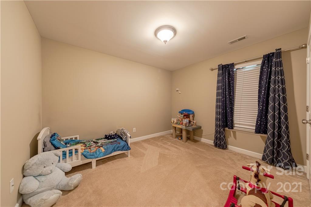 303 Lorraine Road Fort Mill, SC 29708 - Photo 26 of 30 a room with furniture and a flat screen tv