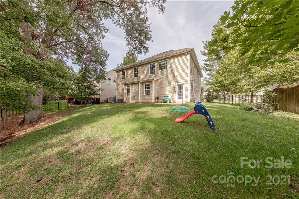 303 Lorraine Road Fort Mill, SC 29708 - Photo 28 of 30 a view of a house with a yard and a tree