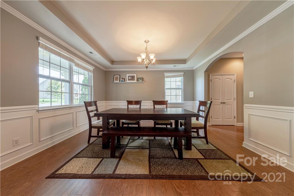 303 Lorraine Road Fort Mill, SC 29708 - Photo 4 of 30 a view of a a dining room with furniture window and wooden floor