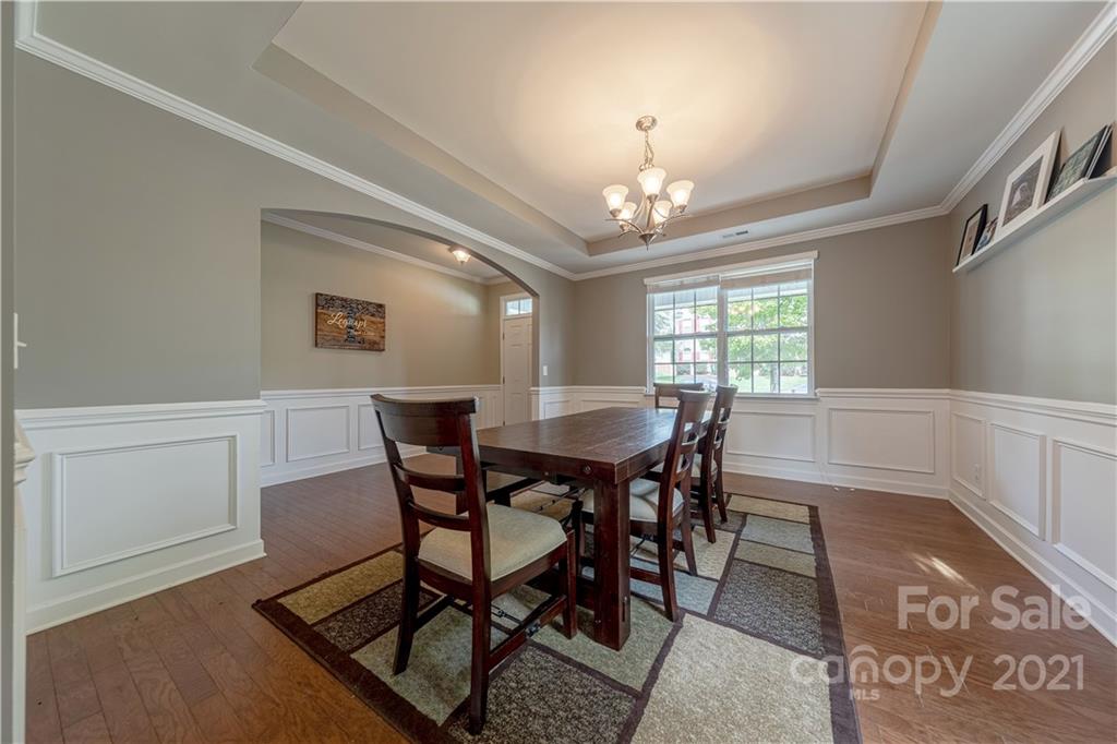 303 Lorraine Road Fort Mill, SC 29708 - Photo 5 of 30 a view of a dining room with furniture and chandelier