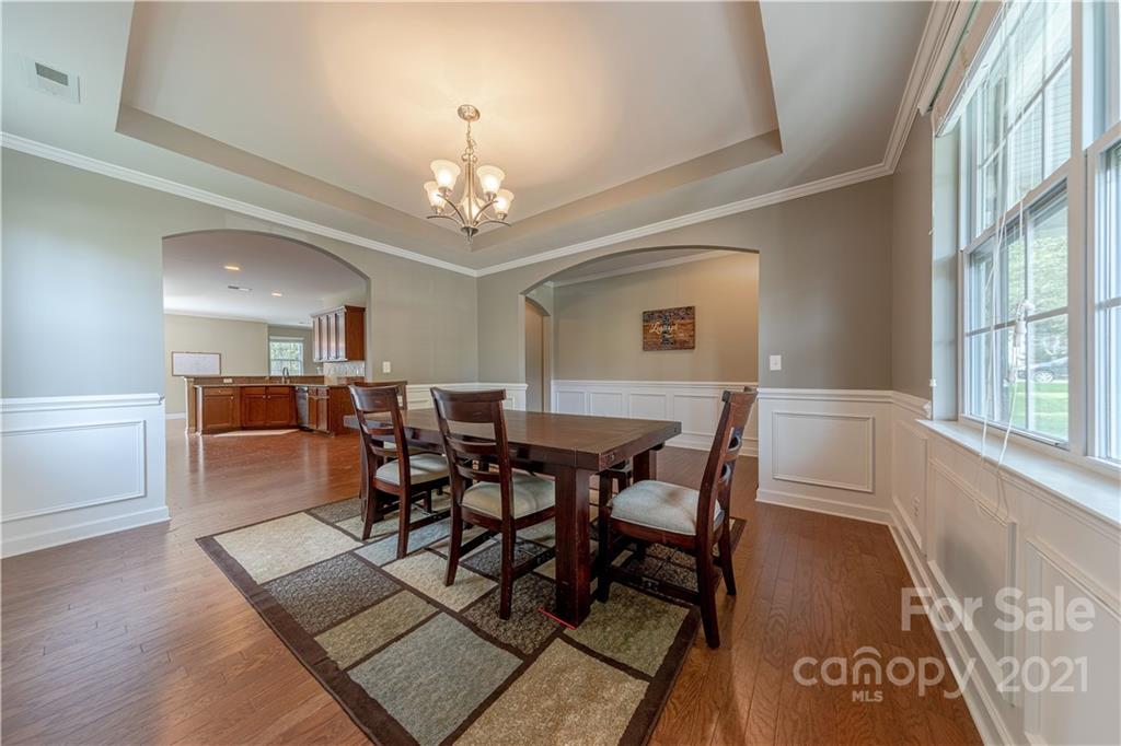 303 Lorraine Road Fort Mill, SC 29708 - Photo 6 of 30 a view of a dining room with furniture and chandelier