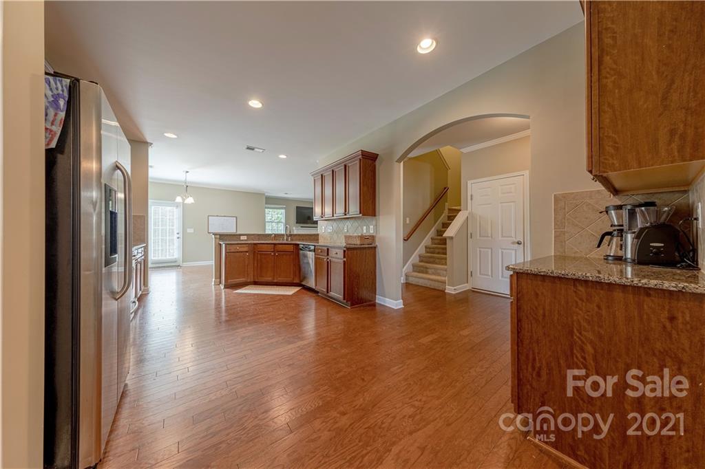 303 Lorraine Road Fort Mill, SC 29708 - Photo 7 of 30 a view of a kitchen with furniture and wooden floor