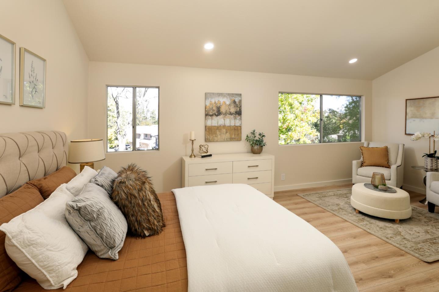 10176 Camberley Lane Cupertino, CA 95014 - Photo 11 of 22 a spacious bedroom with a bed and a couch
