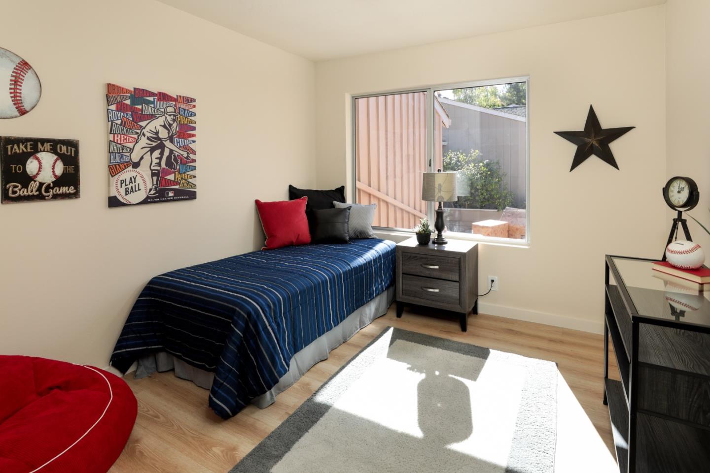 10176 Camberley Lane Cupertino, CA 95014 - Photo 14 of 22 a bedroom with a bed and wooden floor