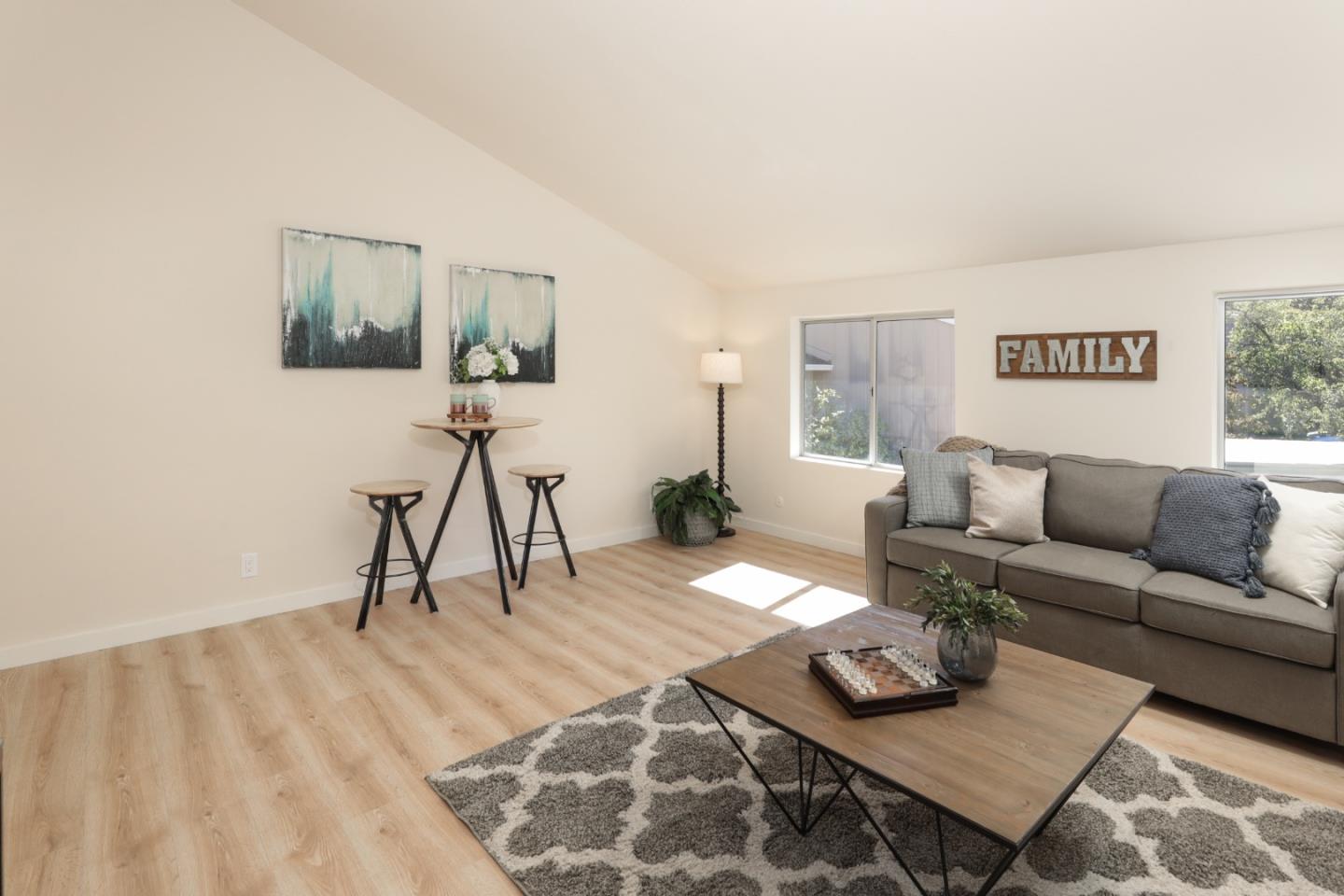 10176 Camberley Lane Cupertino, CA 95014 - Photo 16 of 22 a living room with furniture and a wooden floor