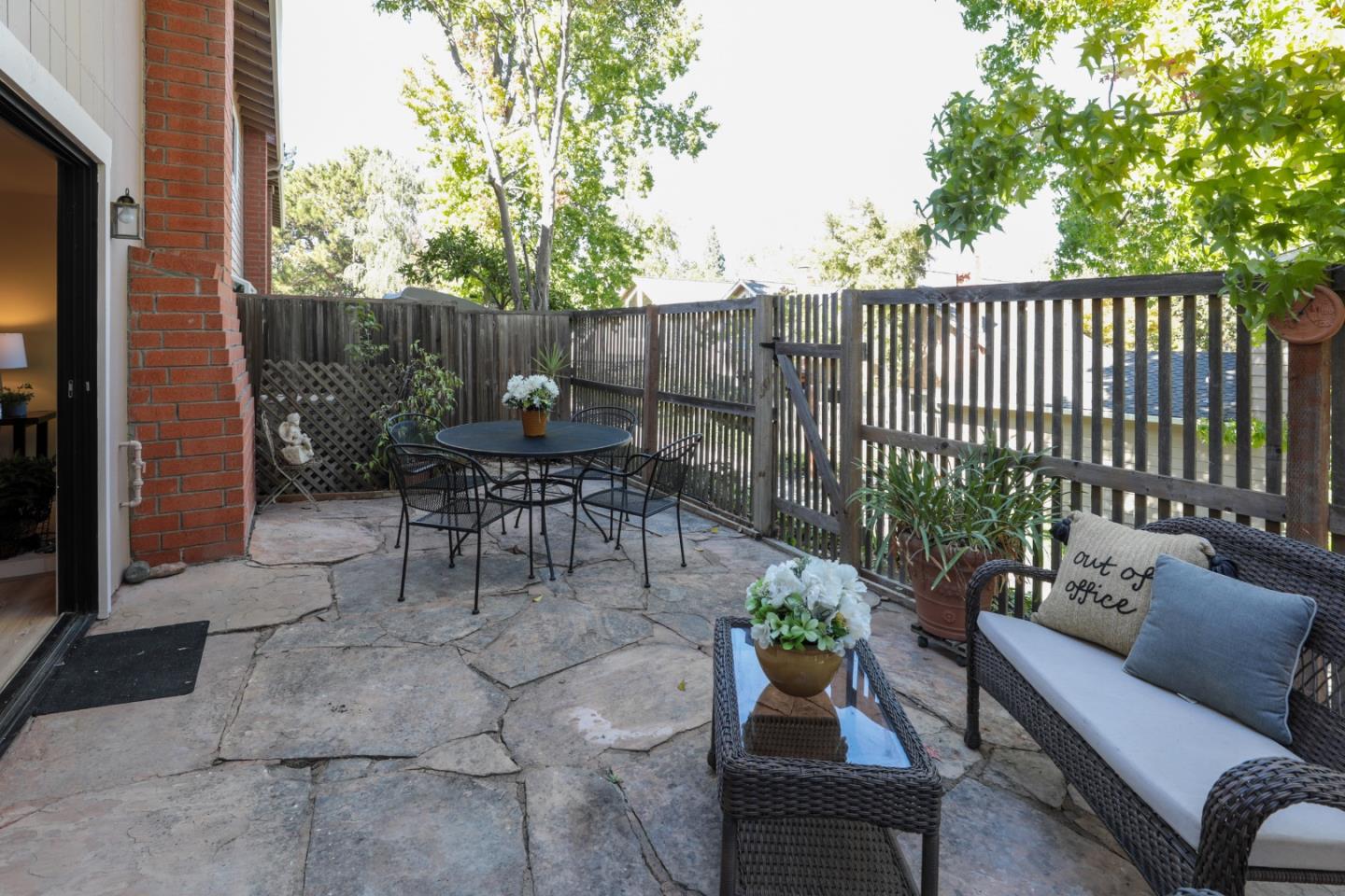 10176 Camberley Lane Cupertino, CA 95014 - Photo 20 of 22 a view of a patio with a dining table and chairs