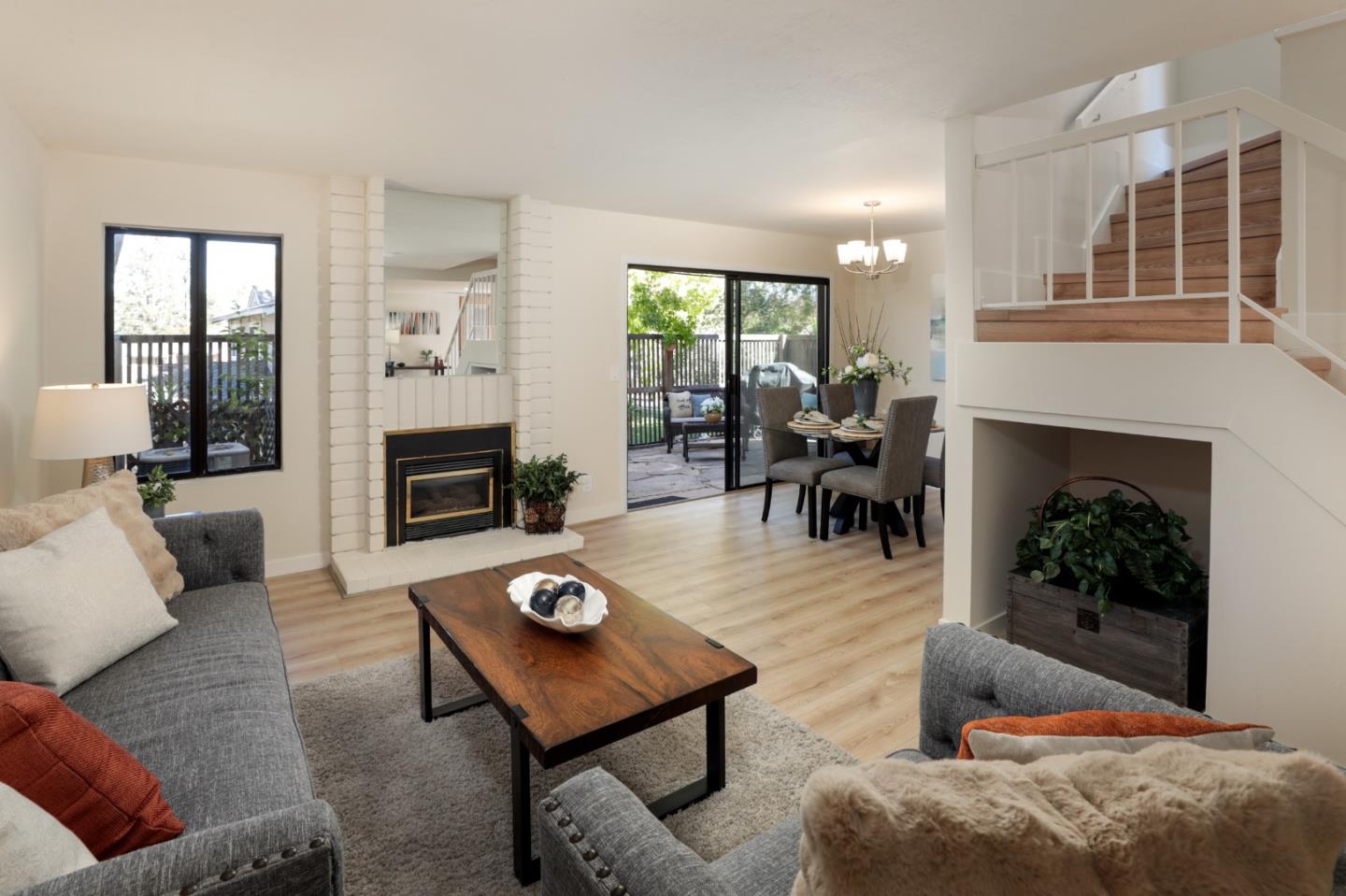 10176 Camberley Lane Cupertino, CA 95014 - Photo 2 of 22 a living room with furniture and a fireplace