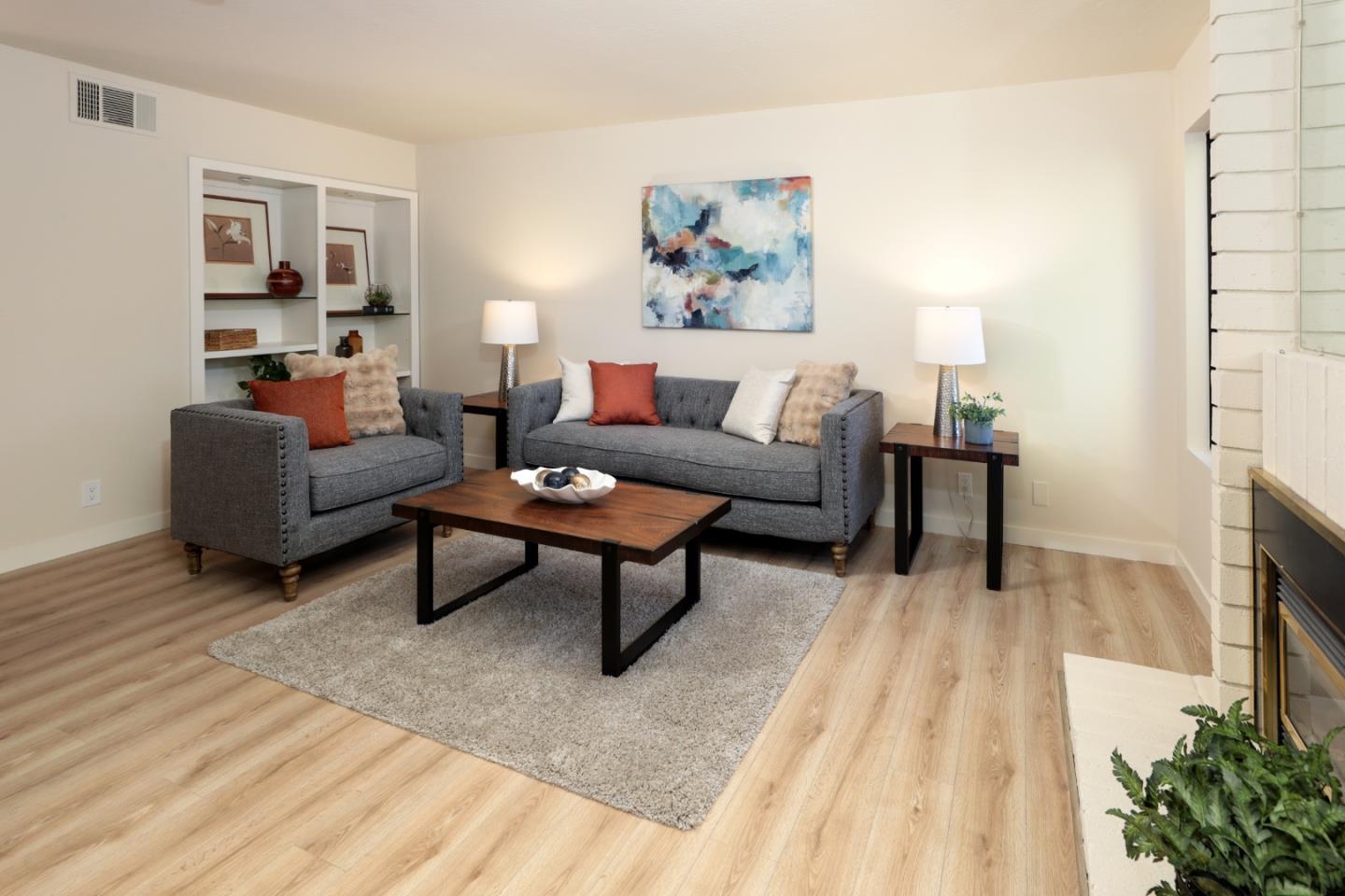 10176 Camberley Lane Cupertino, CA 95014 - Photo 3 of 22 a living room with furniture and a fireplace
