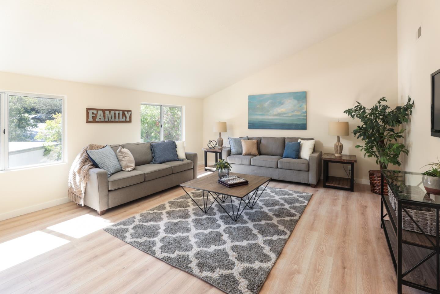 10176 Camberley Lane Cupertino, CA 95014 - Photo 10 of 22 a living room with furniture and a couch
