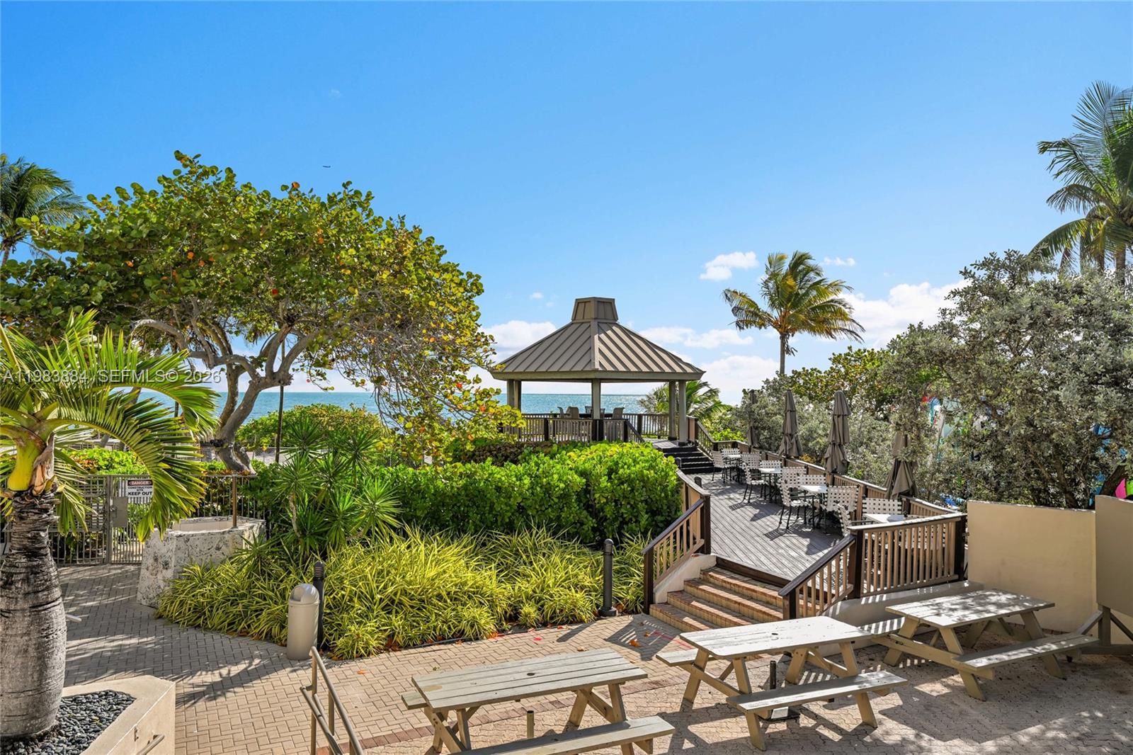 1111 Crandon Boulevard, Unit C504 Key Biscayne, FL 33149 - Photo 16 of 18 a view of a terrace with sitting area