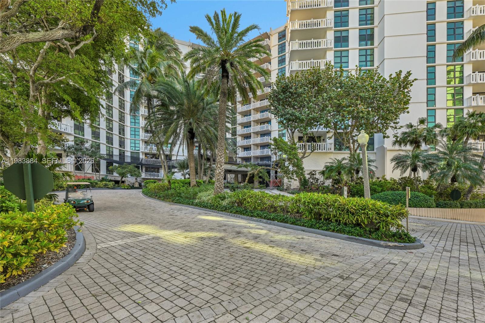 1111 Crandon Boulevard, Unit C504 Key Biscayne, FL 33149 - Photo 17 of 18 a view of a garden with a building