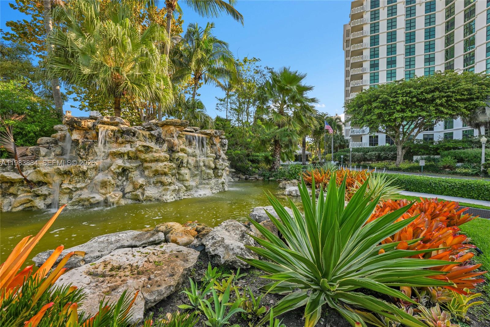 1111 Crandon Boulevard, Unit C504 Key Biscayne, FL 33149 - Photo 18 of 18 a view of a lake with a building in the background