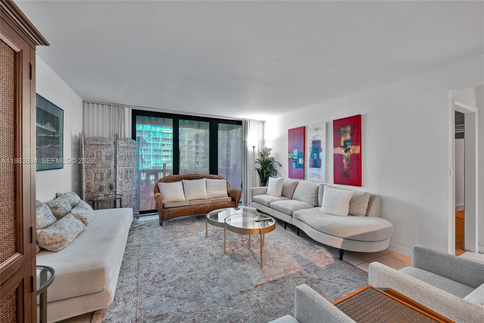 1111 Crandon Boulevard, Unit C504 Key Biscayne, FL 33149 - Photo 6 of 18 a living room with furniture and a large window