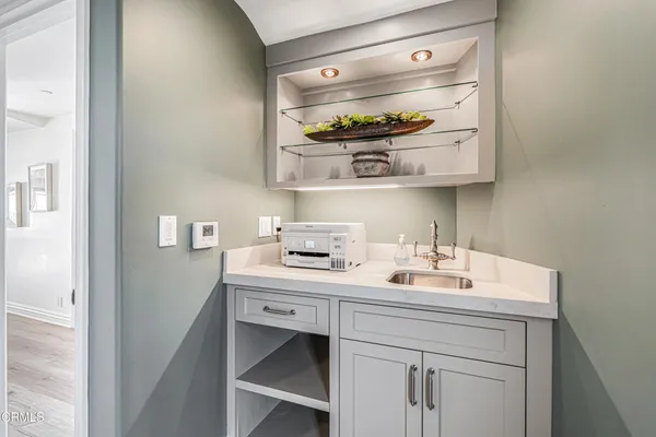 a bathroom with a toilet a sink and a mirror