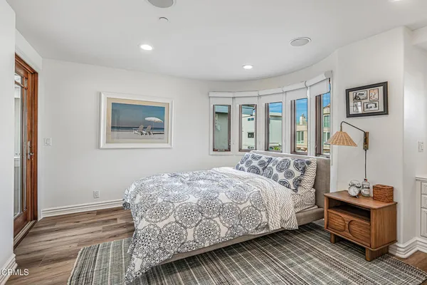 a bedroom with two beds and a window