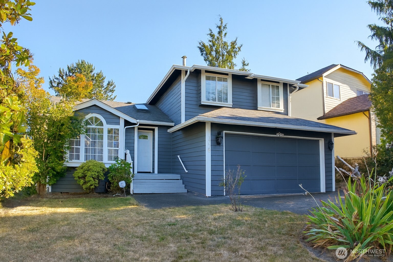 1723 Southwest 324th Street Federal Way, WA 98023 - Photo 1 of 21 a front view of a house with a garden