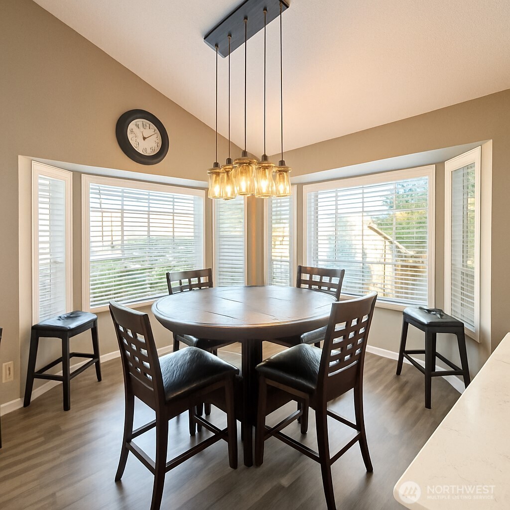 1723 Southwest 324th Street Federal Way, WA 98023 - Photo 7 of 21 a view of a dining room with furniture window and wooden floor