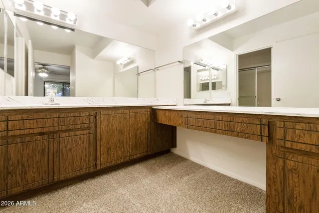 a white toilet sitting next to a shower