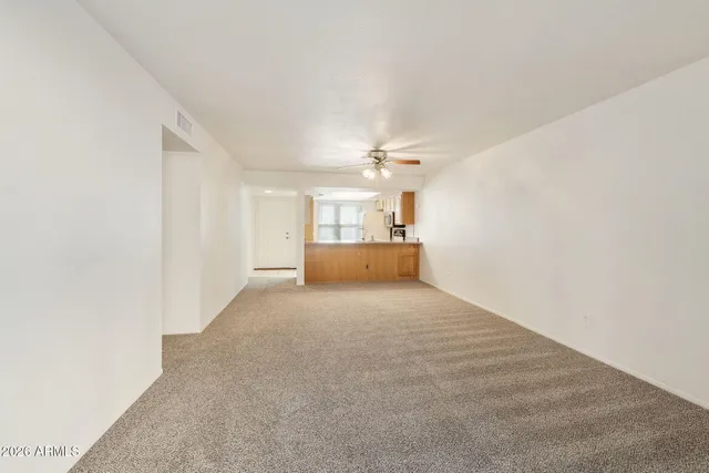 an empty room with fan