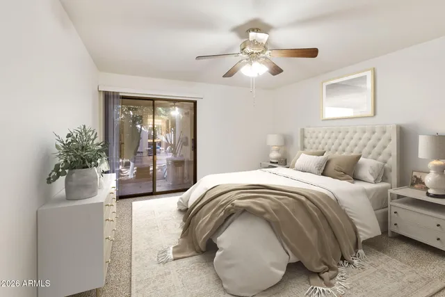 a living room with furniture potted plant and a chandelier