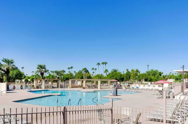 a view of a house with a yard and a garden