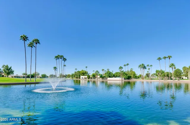 a kitchen with granite countertop cabinets stainless steel appliances and a counter space