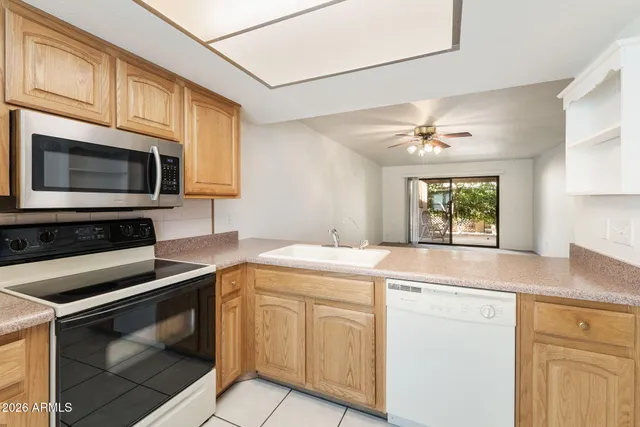 a kitchen with a refrigerator sink and microwave