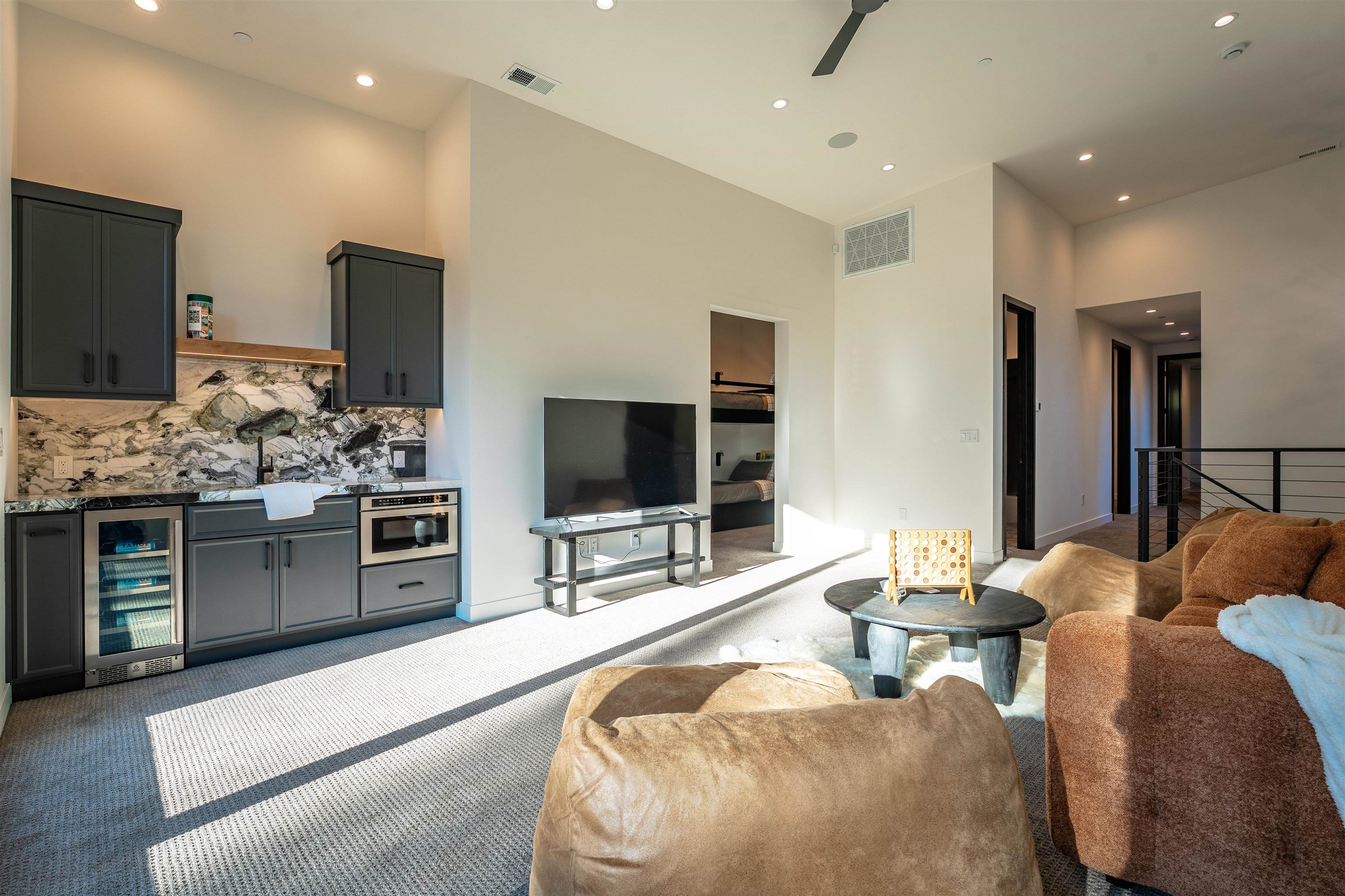 9090 Horned Lark Court Truckee, CA 96161 - Photo 18 of 28 a living room with stainless steel appliances furniture and a flat screen tv